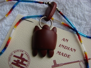 this is a genuine Catlinite turtle charm like the one liberty wears made by Mato Welch of the Pipestone Indian Shrine Association. I first wrote about it three years ago never having seen one so I was delighted to find this one on eBay. Still waiting for it to do some of the things liberties turtle charm does. :-)